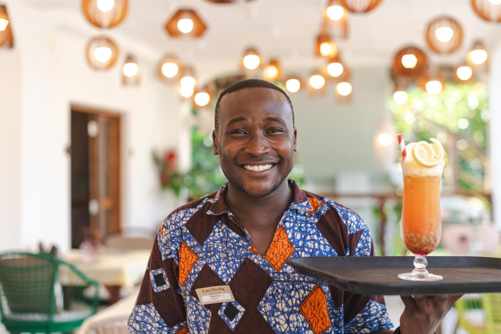 Zanzibella Hotel & Spa Kiwengwa  Luaran gambar A waiter at the Serena Hotel in Kampala, Uganda